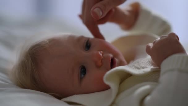 Female Finger Caressing Face Tiny Little Baby Girl Lying Bed — Stock Video