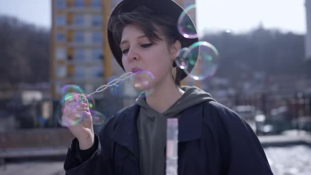 Carefree Relaxed Young Woman Blowing Soap Bubbles Smiling Standing City — Video