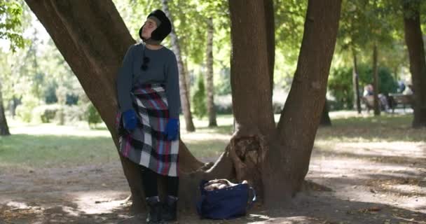 Desperate Frustrated Homeless Woman Hugging Tree Trunk Slow Motion Standing — Stock Video