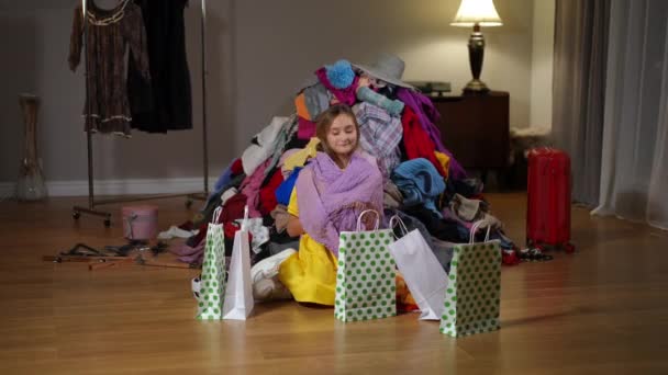 Self Confident Teen Girl Choosing New Scarf Sitting Pile Clothes — Stock Video