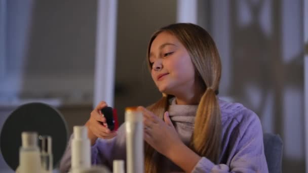 Confident Girl Combing Ponytails Smiling Sitting Home Indoors Evening Portrait — Stock Video