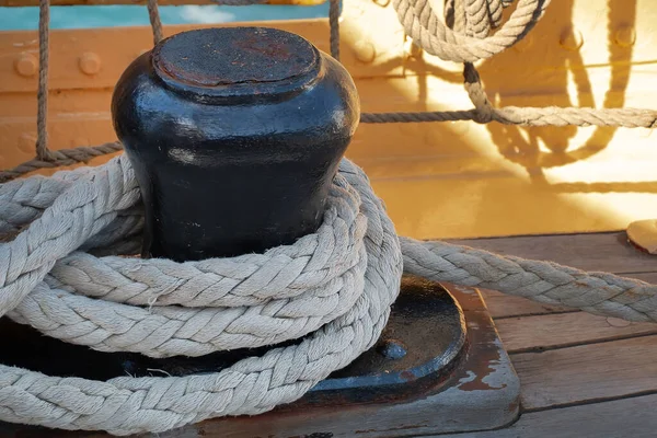 Ropes for sail control on metal holders, details of the device of a yacht, board of a sailing ship close up