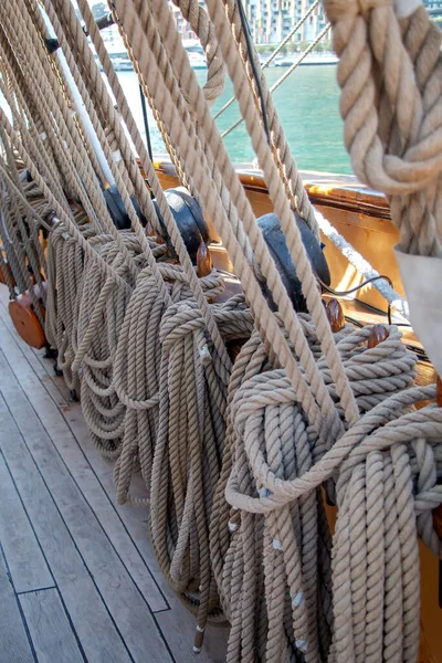 Ropes to control the sails, equipment of the yacht, details of sailing ship, close up