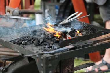 Tools for a blacksmith, coal and fire, close-up