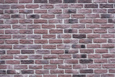 Koyu kırmızı tuğlalı eski bir duvarın desenli arka planı