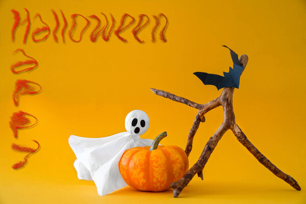 Ghost, pumpkin and bats on orange background with inscription Happy Halloween. Concept of Halloween