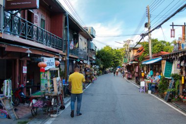 treet scene with small shops and old wooden houses in Chiang Khan, province of Loei, northern Thailand