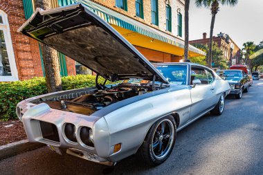 Fernandina Beach, FL - October 18, 2014: Wide angle front corner view of a 1970 Pontiac GTO coupe at a classic car show in Fernandina Beach, Florida.