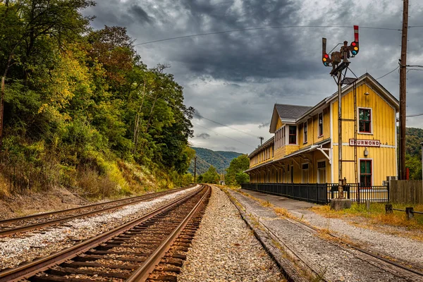 Former train depot at abandoned Thurmond ghost town during Autumn leaf color change at New River Gorge National Park, West Virginia.