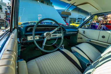Fernandina Beach, FL - October 18, 2014: Wide angle interior view of a 1964 Chevrolet Impala SS hardtop coupe at a classic car show in Fernandina Beach, Florida.