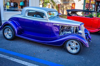 Fernandina Beach, FL - October 18, 2014: Wide angle low perspective side view of a 1934 Ford 3 Window Coupe at a classic car show in Fernandina Beach, Florida.