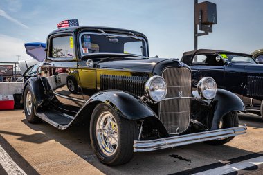 Lebanon, TN - May 14, 2022: Low perspective front corner view of a 1932 Ford Model B Deluxe 3 window deuce coupe at a local car show.