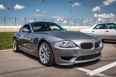 Lebanon, TN - May 14, 2022: Low perspective front corner view of a 2007 BMW Z4 M Coupe at a local car show. clipart