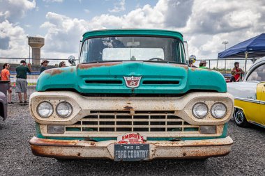 Lebanon, TN - May 14, 2022: Low perspective front view of a 1960 Ford F100 Pickup Truck at a local car show. clipart