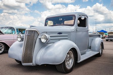 Lebanon, TN - May 14, 2022: Low perspective front corner view of a 1937 Chevrolet Master Pickup Truck at a local car show. clipart