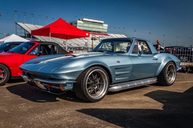 Lebanon, TN - May 13, 2022: Low perspective front corner view of a 1964 Chevrolet Corvette Stingray Coupe at a local car show.