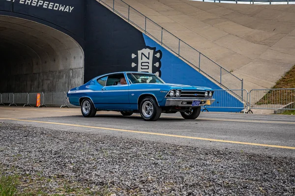 Lebanon, TN - May 14, 2022: Wide angle front corner view of a 1969 Chevrolet Yenko Chevelle Hardtop Coupe driving on a road leaving a local car show.