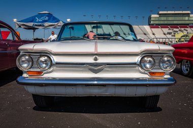 Lebanon, TN - May 13, 2022: Low perspective front view of a 1964 Chevrolet Corvair Monza Convertible at a local car show.