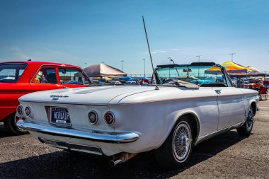 Lebanon, TN - May 13, 2022: Low perspective rear corner view of a 1964 Chevrolet Corvair Monza Convertible at a local car show.