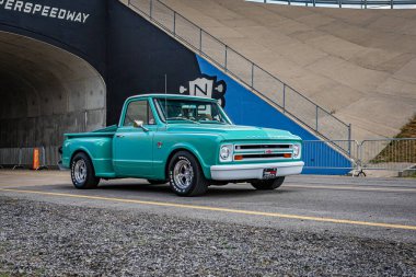 Lebanon, TN - May 14, 2022: Wide angle front corner view of a 1967 Chevrolet Stepside Pickup Truck at a local car show.