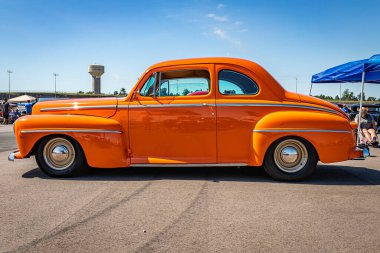 Lebanon, TN - May 13, 2022: Low perspective side view of a 1946 Ford Super Deluxe Coupe at a local car show.