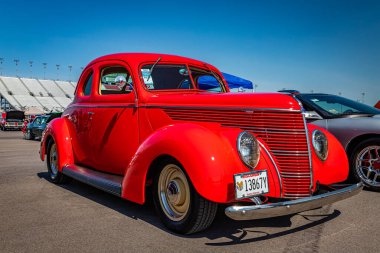 Lebanon, TN - May 13, 2022: Low perspective front corner view of a 1938 Ford Standard 5 Window Coupe at a local car show.