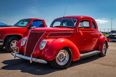 Lebanon, TN - May 13, 2022: Low perspective front corner view of a 1937 Ford Model 78 Deluxe Coupe at a local car show.
