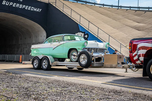 Lebanon, TN - May 14, 2022: Wide angle front corner view of a 1956 Ford Fairlane Crown Victoria Sedan driving on a road leaving a local car show.