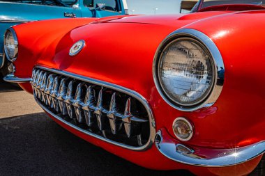 Lebanon, TN - May 13, 2022: Low perspective close up view of  a 1957 Chevrolet Corvette Convertible grille and headlights at a local car show.