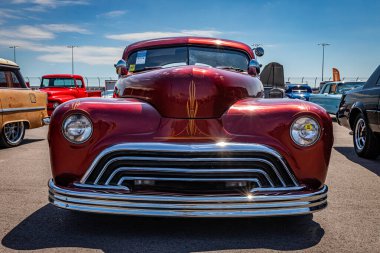 Lebanon, TN - May 13, 2022: Low perspective front view of a custom 1947 Ford 5 Window Coupe at a local car show.