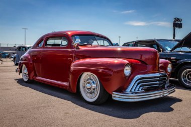 Lebanon, TN - May 13, 2022: Low perspective front corner view of a custom 1947 Ford 5 Window Coupe at a local car show.