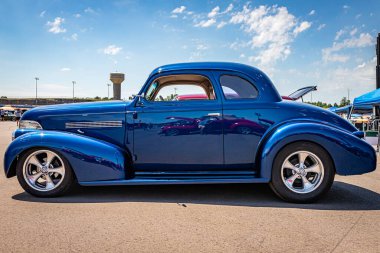 Lebanon, TN - May 13, 2022: Low perspective side view of a 1939 Chevrolet Master Deluxe Coupe at a local car show.