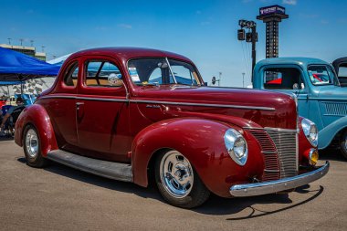 Lebanon, TN - May 13, 2022: Low perspective front corner view of a 1940 Ford Deluxe Flathead V8 Coupe at a local car show.