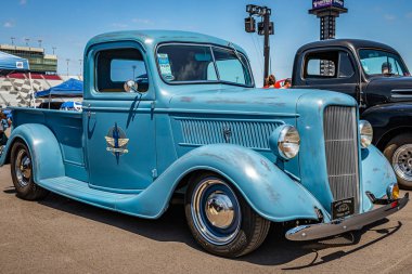 Lebanon, TN - May 13, 2022: Low perspective front corner view of a Customized 1937 Ford Pickup Truck at a local car show.
