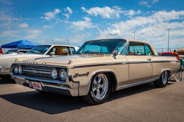 Lebanon, TN - May 13, 2022: Low perspective front corner view of a 1964 Oldsmobile Dynamic 88 Holiday Coupe at a local car show.