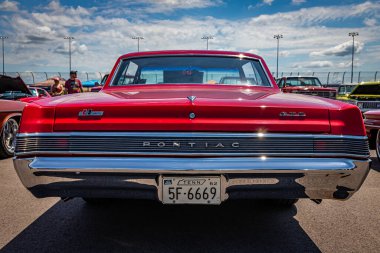 Lebanon, TN - May 13, 2022: Low perspective rear view of a 1965 Pontiac LeMans GTO Hardtop Coupe at a local car show.