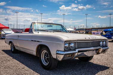 Lebanon, TN - May 13, 2022: Low perspective front corner view of a 1965 Buick Skylark Convertible at a local car show.