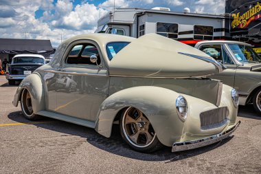 Lebanon, TN - May 13, 2022: Low perspective front corner view of a 1941 Willys Americar Coupe at a local car show.