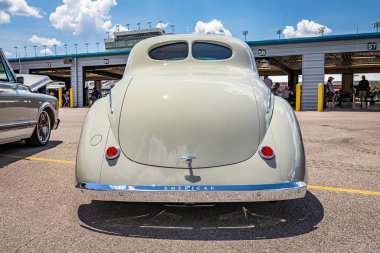 Lebanon, TN - May 13, 2022: Wide angle low perspective rear view of a 1941 Willys Americar Coupe at a local car show.