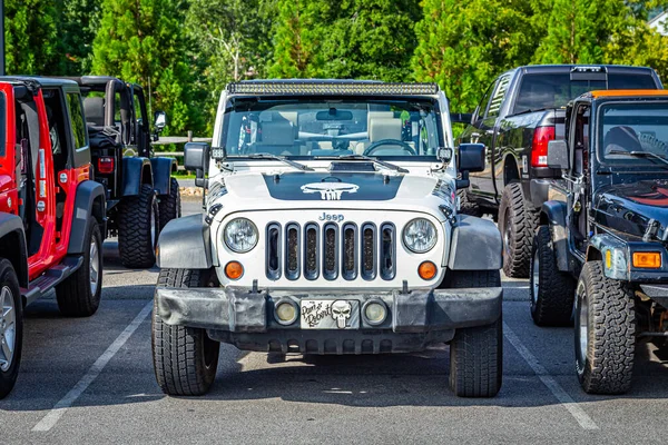 Pigeon Forge, TN - August 25, 2017: Modified Jeep Wrangler Sport Unlimited JK Soft Top at a local enthusiast rally.