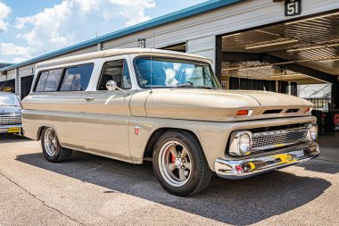 Lebanon, TN - May 13, 2022: Low perspective front corner view of a 1964 Chevrolet C10 Suburban Carryall at a local car show.
