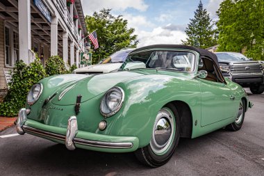 Highlands, NC - June 10, 2022: Low perspective front corner view of a 1953 Porsche 356 America Roadster Convertible at a local car show.