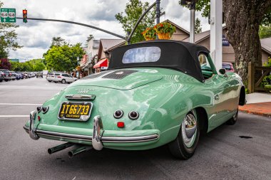 Highlands, NC - June 10, 2022: Low perspective rear corner view of a 1953 Porsche 356 America Roadster Convertible at a local car show.