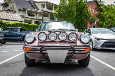 Highlands, NC - June 10, 2022: Low perspective front view of a Customized 1987 Porsche 911 Carrera at a local car show.