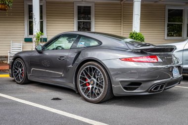 Highlands, NC - June 10, 2022: Low perspective rear corner view of a 2014 Porsche 911 Turbo S Coupe at a local car show.