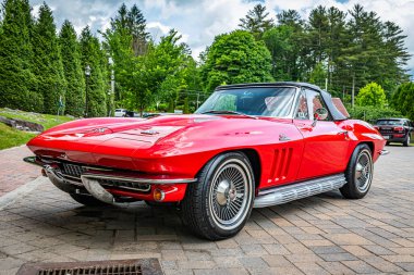 Highlands, NC - June 10, 2022: Low perspective front corner view of a 1966 Chevrolet Corvette Stingray Convertible at a local car show.