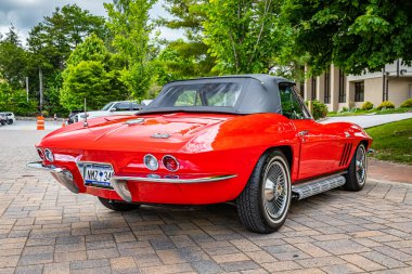 Highlands, NC - June 10, 2022: Low perspective rear corner view of a 1966 Chevrolet Corvette Stingray Convertible at a local car show.