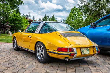 Highlands, NC - June 10, 2022: Low perspective rear corner view of a 1973 Porsche 911 S Targa Coupe at a local car show.
