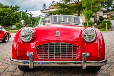Highlands, NC - June 10, 2022: Low perspective front view of a 1957 Triumph TR3 Cabriolet at a local car show.