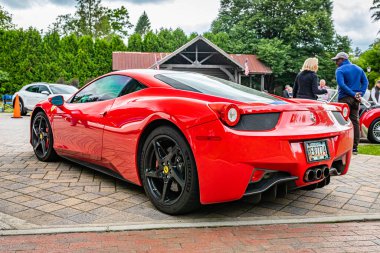 Highlands, NC - June 10, 2022: Low perspective rear corner view of a 2013 Ferrari 458 Italia Coupe at a local car show.